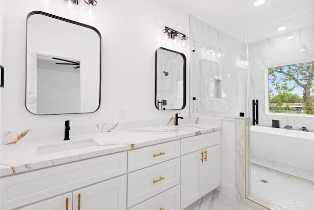 3524 Rebecca St, Houston, TX 77021 - bathroom with marble look tile flooring, a freestanding bath, a marble finish shower, double vanity, and recessed lighting