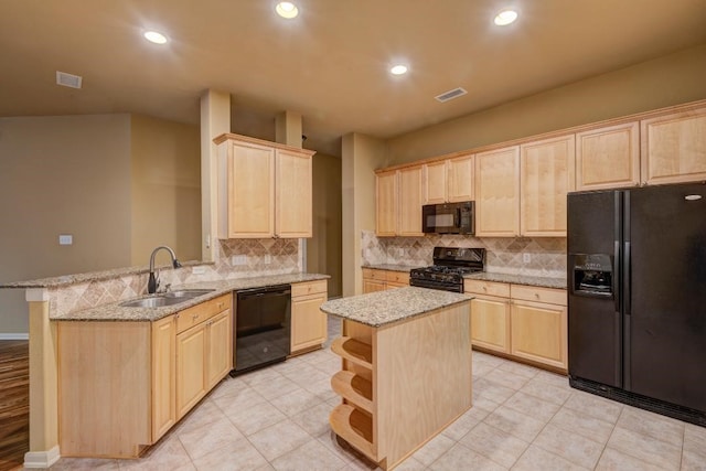 10406 Friars Hill Ln, Houston, TX 77070 - kitchen featuring black appliances, light brown cabinets, tasteful backsplash, a peninsula, and recessed lighting