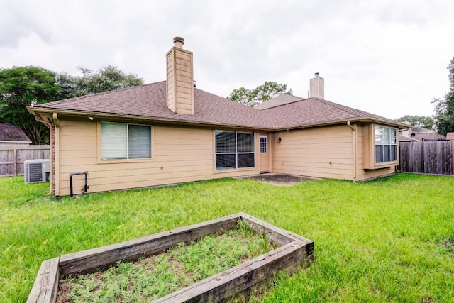10406 Friars Hill Ln, Houston, TX 77070 - back of house with a chimney, a garden, and a shingled roof