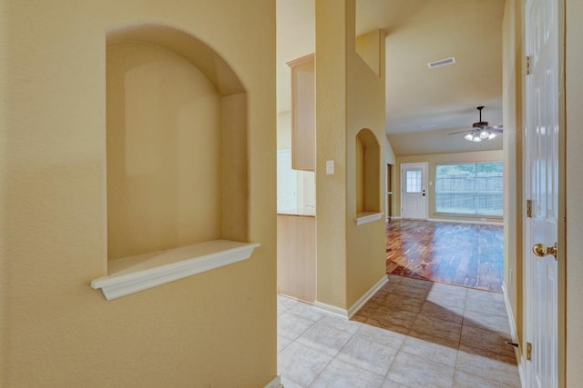 10406 Friars Hill Ln, Houston, TX 77070 - hallway with tile patterned flooring and arched walkways