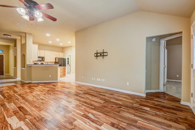 10406 Friars Hill Ln, Houston, TX 77070 - unfurnished living room featuring light wood-style flooring, a ceiling fan, lofted ceiling, and recessed lighting
