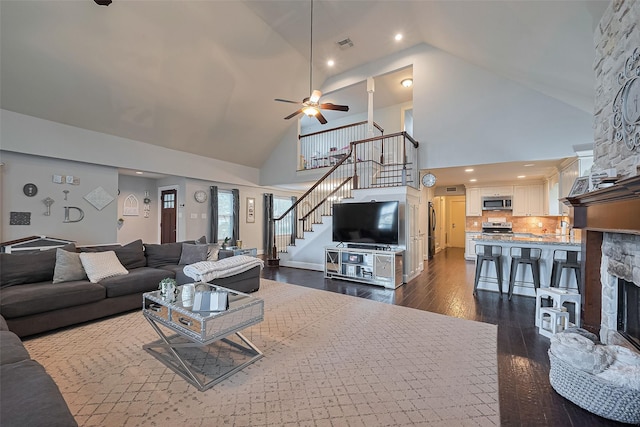152 Snug Harbor Dr, Conroe, TX 77356 - living area featuring stairway, high vaulted ceiling, ceiling fan, dark wood-style flooring, and recessed lighting