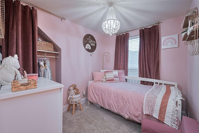 152 Snug Harbor Dr, Conroe, TX 77356 - carpeted bedroom with a chandelier and baseboards