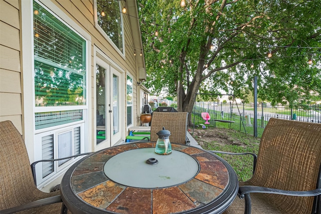 152 Snug Harbor Dr, Conroe, TX 77356 - fenced backyard featuring a patio area and french doors