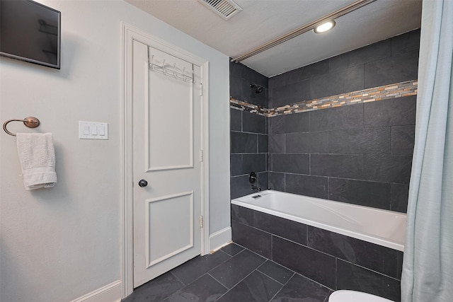 152 Snug Harbor Dr, Conroe, TX 77356 - full bathroom with tiled shower / bath and baseboards