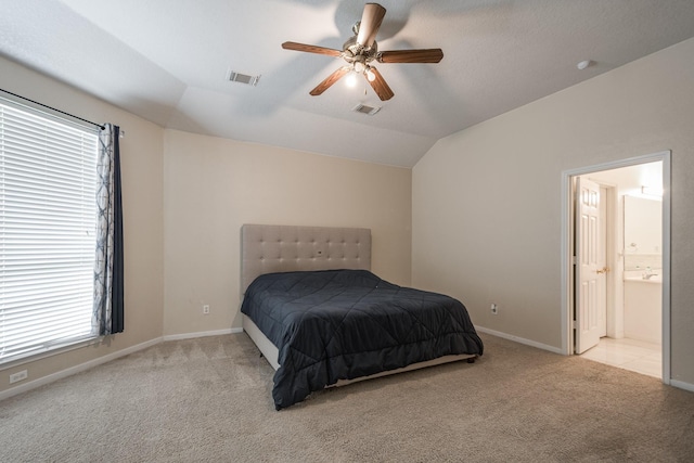 16311 Sylvan Dale Dr, Humble, TX 77346 - bedroom with carpet flooring, vaulted ceiling, multiple windows, ensuite bathroom, and a ceiling fan