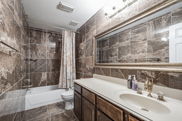 16311 Sylvan Dale Dr, Humble, TX 77346 - bathroom featuring shower / tub combo with curtain, tile walls, vanity, and a textured ceiling
