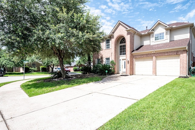 16311 Sylvan Dale Dr, Humble, TX 77346 - traditional-style home with brick siding, concrete driveway, an attached garage, a front lawn, and roof with shingles