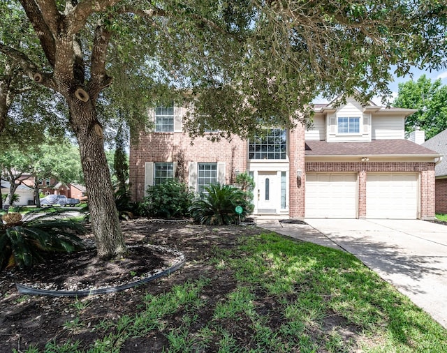 16311 Sylvan Dale Dr, Humble, TX 77346 - view of front facade featuring brick siding, concrete driveway, and an attached garage