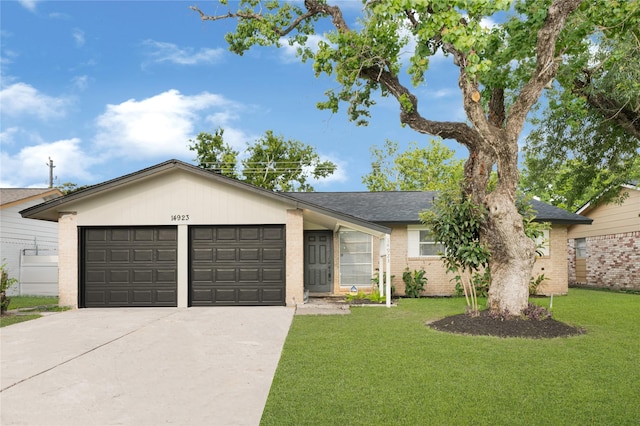 14923 Bathurst Dr, Houston, TX 77053 - ranch-style home with a garage, brick siding, driveway, and a front lawn