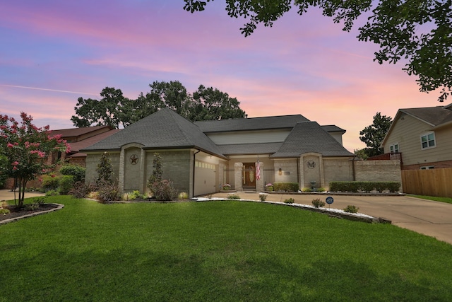 7310 Blenheim Palace Ln, Houston, TX 77095 - french provincial home with roof with shingles, an attached garage, brick siding, and driveway