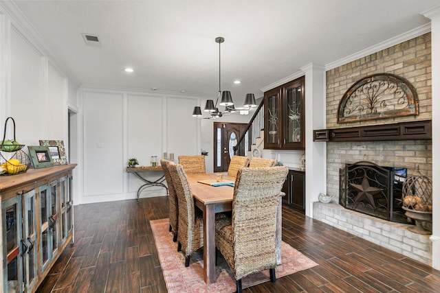 7310 Blenheim Palace Ln, Houston, TX 77095 - dining space with dark wood-type flooring, a chandelier, a decorative wall, crown molding, and stairs