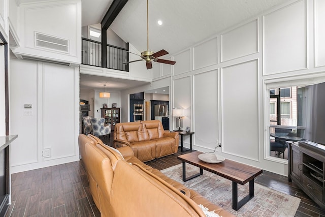 7310 Blenheim Palace Ln, Houston, TX 77095 - living area featuring a decorative wall, dark wood-type flooring, ceiling fan, beam ceiling, and high vaulted ceiling
