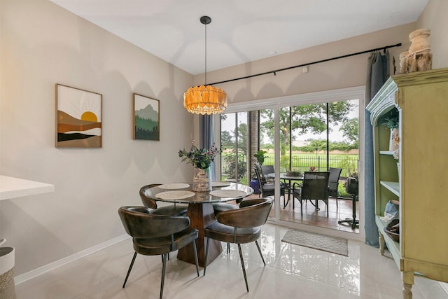 7310 Blenheim Palace Ln, Houston, TX 77095 - dining space featuring a chandelier and baseboards