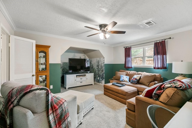7310 Blenheim Palace Ln, Houston, TX 77095 - living room with light colored carpet, a ceiling fan, crown molding, and a textured ceiling