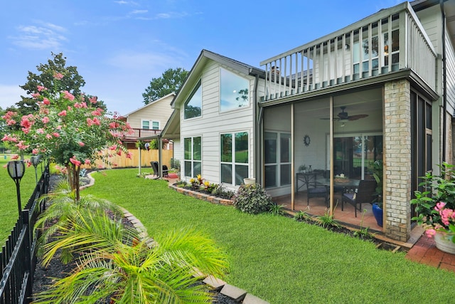 7310 Blenheim Palace Ln, Houston, TX 77095 - view of yard with a balcony, a ceiling fan, and a patio area