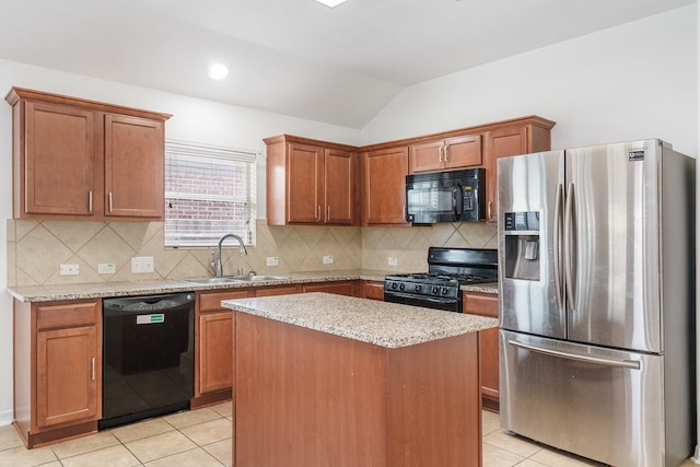 20930 Morgan Knoll Ln, Katy, TX 77449 - kitchen featuring black appliances, vaulted ceiling, light tile patterned floors, a kitchen island, and light stone countertops