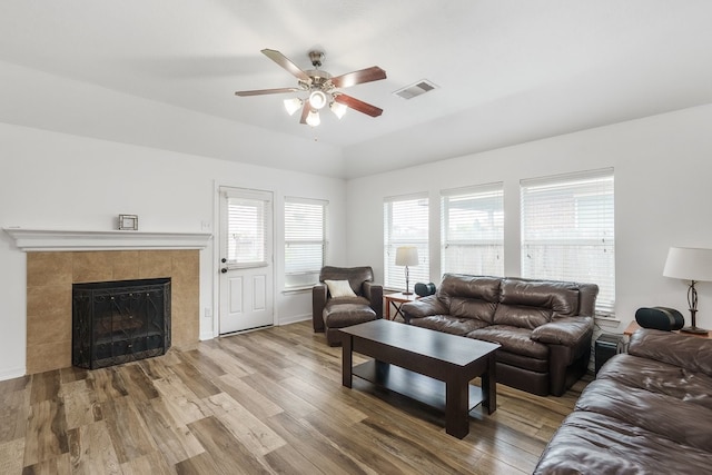 20930 Morgan Knoll Ln, Katy, TX 77449 - living room featuring ceiling fan, wood finished floors, a fireplace, and vaulted ceiling