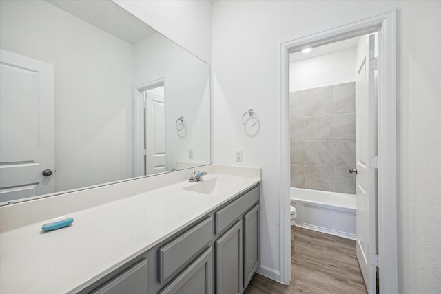 7227 Songlark Landing Ct, Katy, TX 77493 - full bath featuring vanity, wood finished floors, and shower / washtub combination