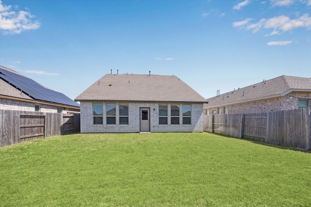 7227 Songlark Landing Ct, Katy, TX 77493 - back of house featuring brick siding, a fenced backyard, and a shingled roof