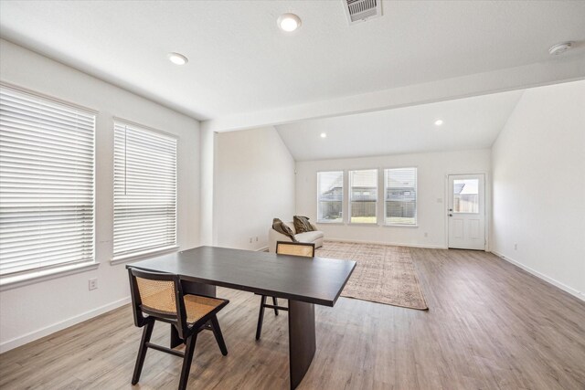 7227 Songlark Landing Ct, Katy, TX 77493 - dining space with light wood-style flooring, lofted ceiling, and recessed lighting