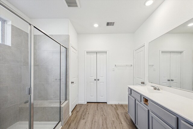 7227 Songlark Landing Ct, Katy, TX 77493 - full bath featuring vanity, wood finished floors, a shower stall, and recessed lighting