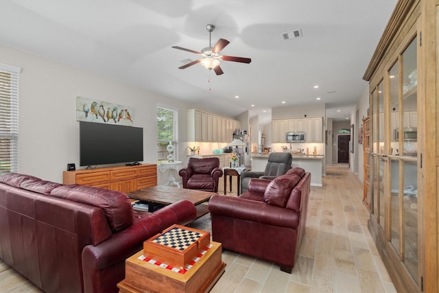 9171 White Tail Dr, Conroe, TX 77303 - living area featuring ceiling fan, light wood-style flooring, and recessed lighting