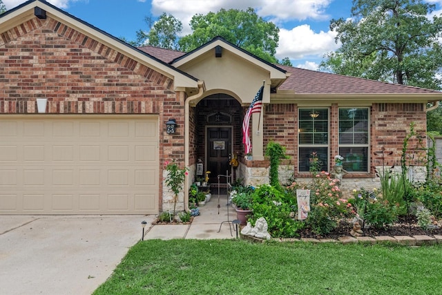 9171 White Tail Dr, Conroe, TX 77303 - view of front of property featuring an attached garage, driveway, brick siding, and a front lawn