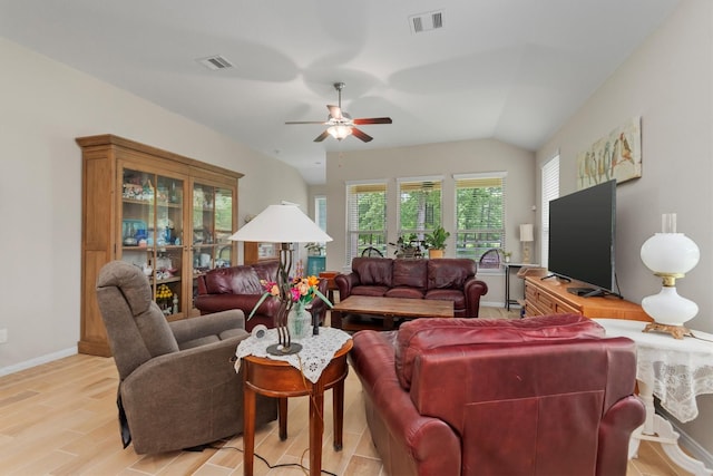 9171 White Tail Dr, Conroe, TX 77303 - living area featuring healthy amount of natural light, ceiling fan, light wood-type flooring, and vaulted ceiling