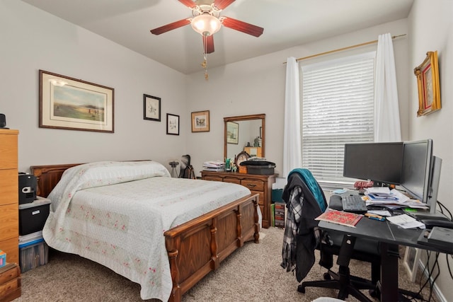 9171 White Tail Dr, Conroe, TX 77303 - bedroom with light colored carpet, a desk, and ceiling fan