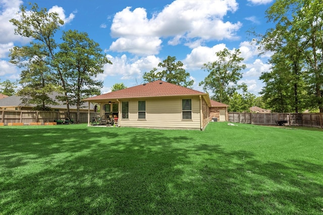 9171 White Tail Dr, Conroe, TX 77303 - rear view of property with a fenced backyard, a patio, and ceiling fan