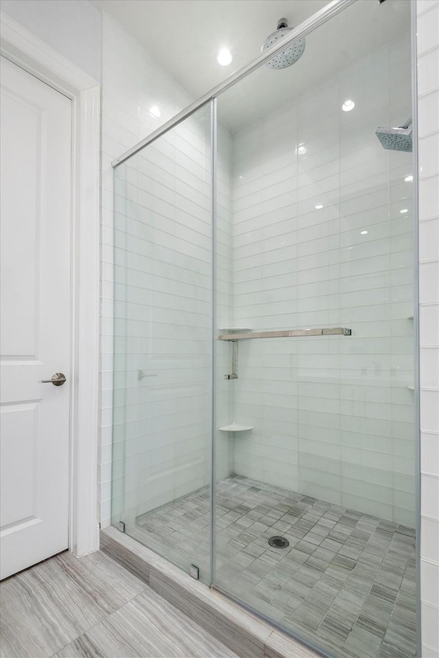 1211 Caroline St Unit 1504, Houston, TX 77002 - bathroom featuring a shower stall and recessed lighting