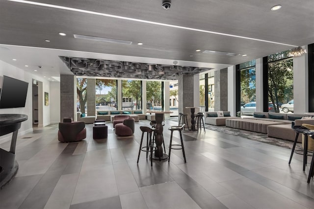 1211 Caroline St Unit 1504, Houston, TX 77002 - building lobby with floor to ceiling windows, recessed lighting, and a surveillance system