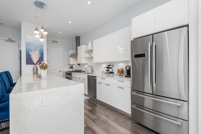 1211 Caroline St Unit 1504, Houston, TX 77002 - kitchen with appliances with stainless steel finishes, white cabinets, modern cabinets, light countertops, and recessed lighting