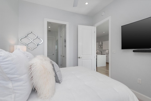 1211 Caroline St Unit 1504, Houston, TX 77002 - bedroom with connected bathroom, a ceiling fan, recessed lighting, and wood finished floors