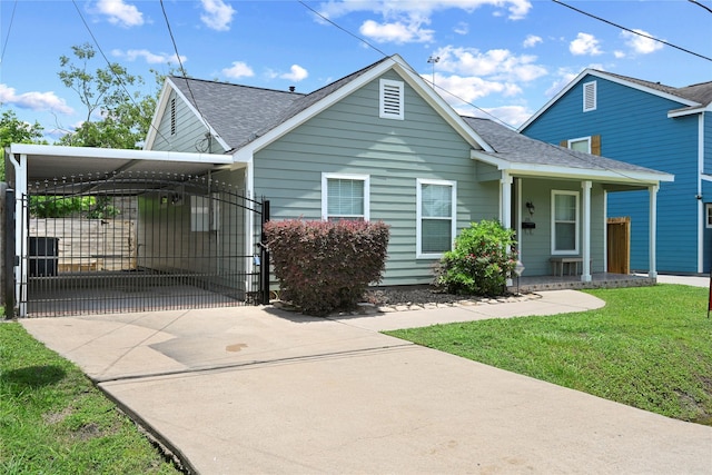 206 Delaney St, Houston, TX 77009 - bungalow-style house with concrete driveway, a shingled roof, a gate, and covered porch