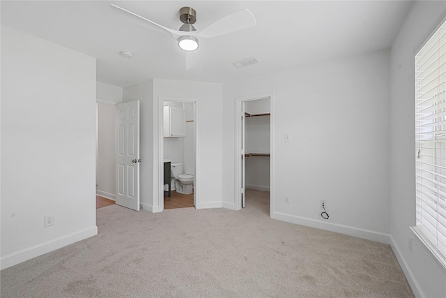 206 Delaney St, Houston, TX 77009 - unfurnished bedroom featuring carpet floors, a walk in closet, connected bathroom, ceiling fan, and a closet