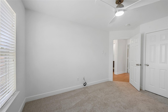 206 Delaney St, Houston, TX 77009 - unfurnished bedroom featuring light carpet, multiple windows, ceiling fan, and a closet