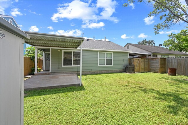 206 Delaney St, Houston, TX 77009 - back of property with a patio area, a fenced backyard, and roof with shingles