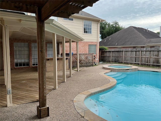 6507 Stone Briar Dr, Pasadena, TX 77505 - view of swimming pool with a patio area and a pool with connected hot tub