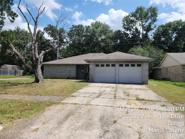 6410 Barrygate Dr, Spring, TX 77373 - view of front of property with a front lawn, an attached garage, concrete driveway, and brick siding