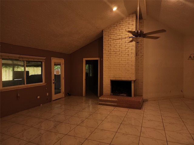 6410 Barrygate Dr, Spring, TX 77373 - unfurnished living room featuring vaulted ceiling, a textured ceiling, a brick fireplace, and a ceiling fan