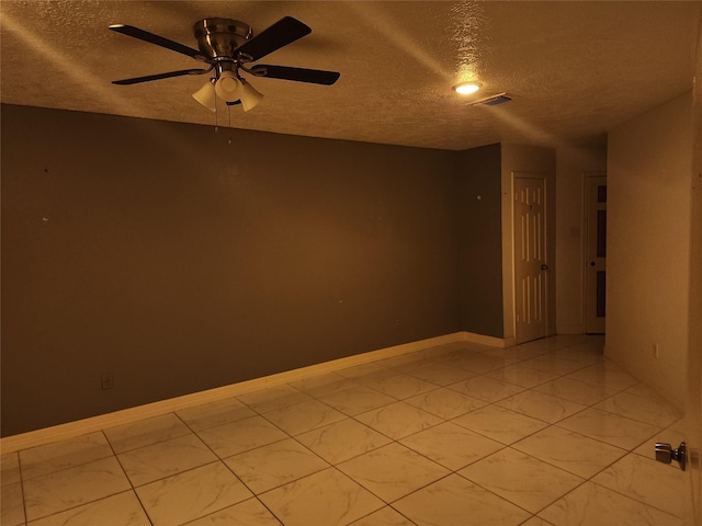 6410 Barrygate Dr, Spring, TX 77373 - empty room featuring a textured ceiling, ceiling fan, and light marble finish flooring