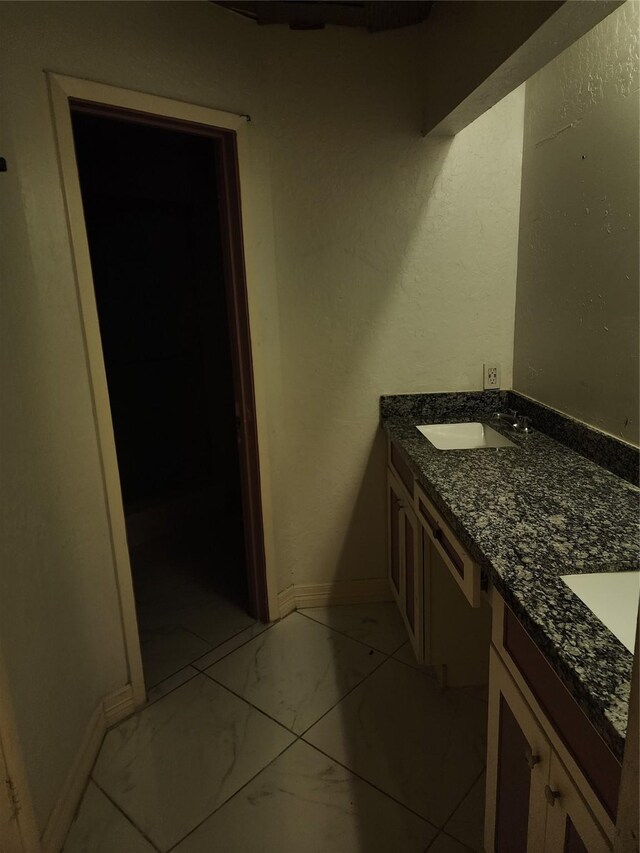6410 Barrygate Dr, Spring, TX 77373 - bathroom with marble look tiles and double vanity