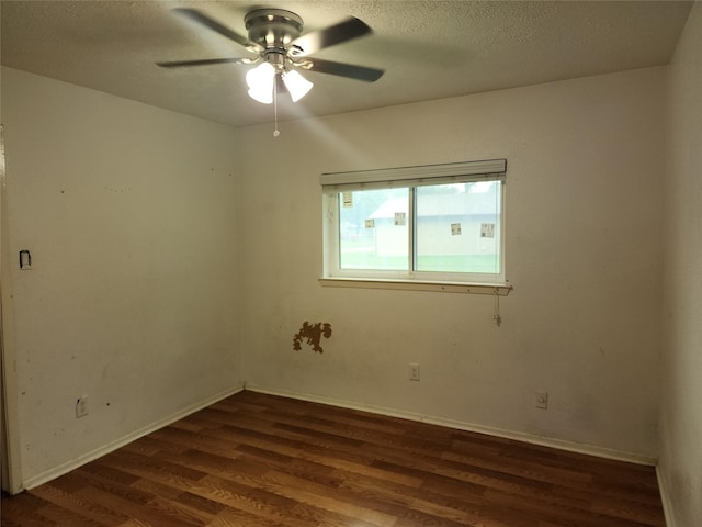 6410 Barrygate Dr, Spring, TX 77373 - unfurnished room featuring dark wood finished floors, ceiling fan, and a textured ceiling