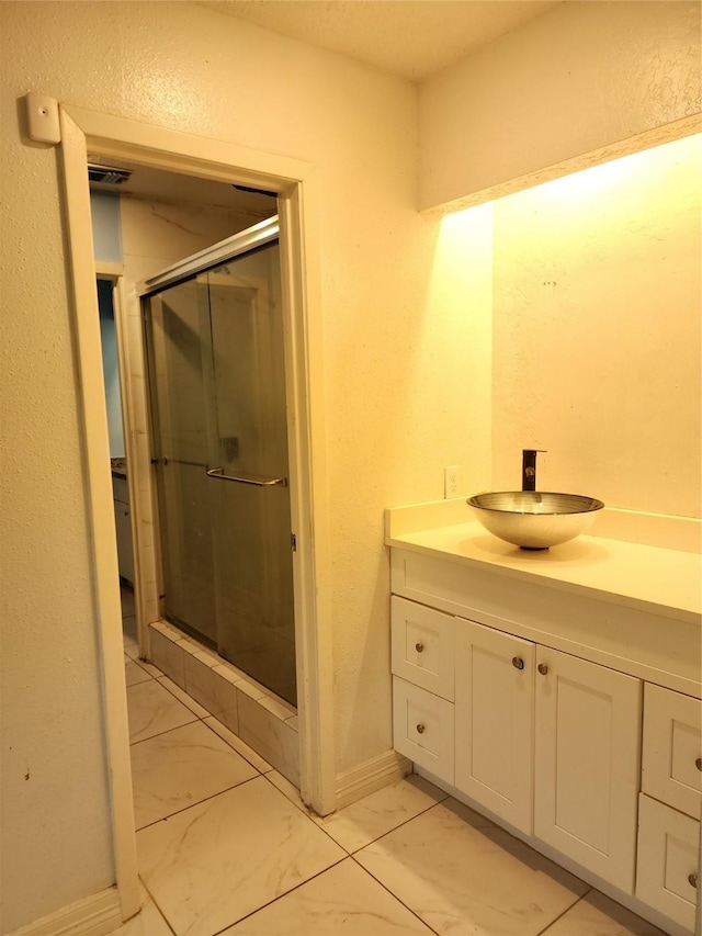 6410 Barrygate Dr, Spring, TX 77373 - bathroom with vanity, a shower stall, and marble look tile flooring