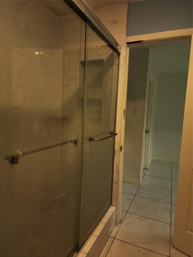 6410 Barrygate Dr, Spring, TX 77373 - bathroom with a stall shower and marble look tile flooring