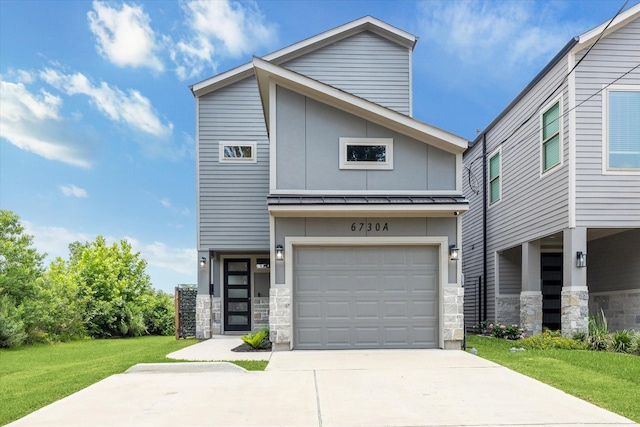 6730 Knox St Unit A, Houston, TX 77091 - contemporary house with concrete driveway, a standing seam roof, stone siding, a front lawn, and a metal roof
