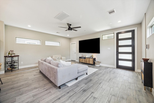 6730 Knox St Unit A, Houston, TX 77091 - living area with light wood-type flooring, ceiling fan, and recessed lighting