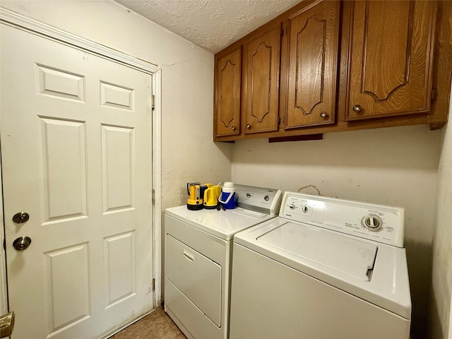 501 S Travis St, Deer Park, TX 77536 - washroom featuring separate washer and dryer, a textured ceiling, and cabinet space